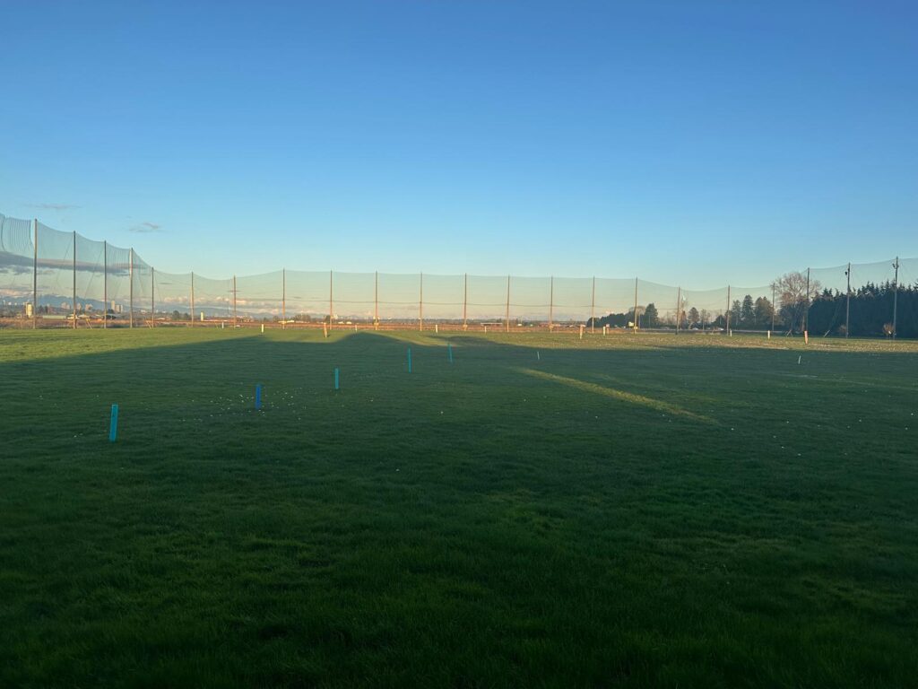 Golf driving range at sunset in Vancouver with practice targets