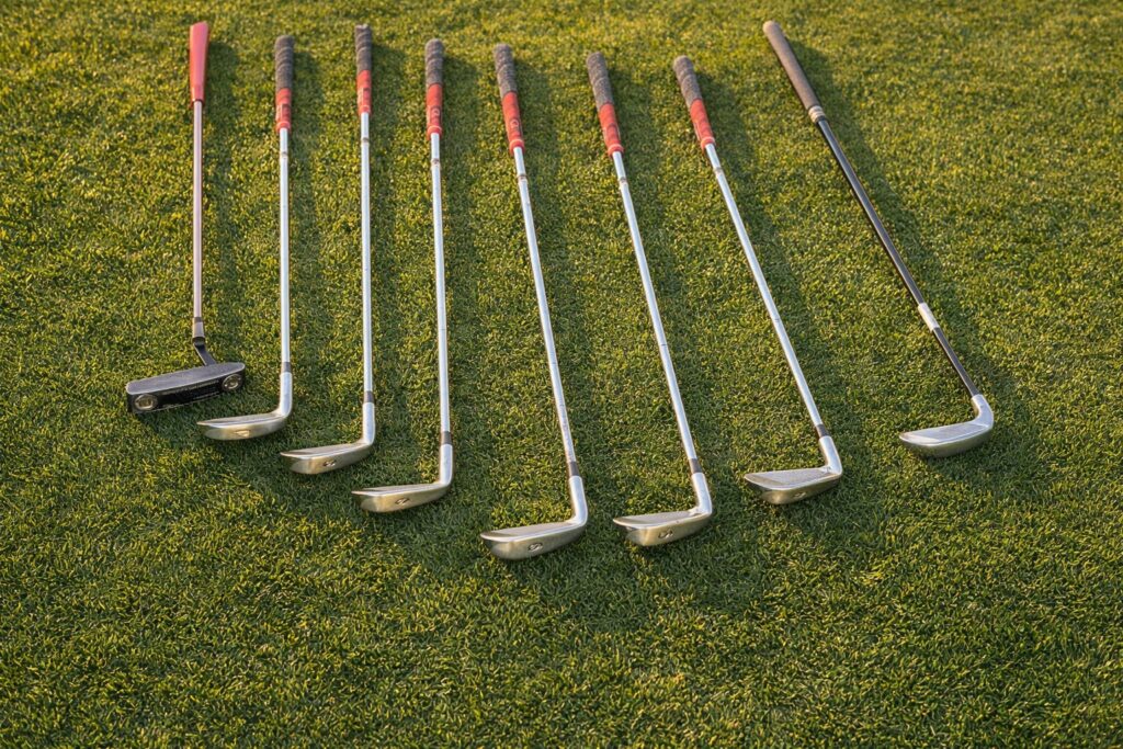 golf clubs in golden sunset light